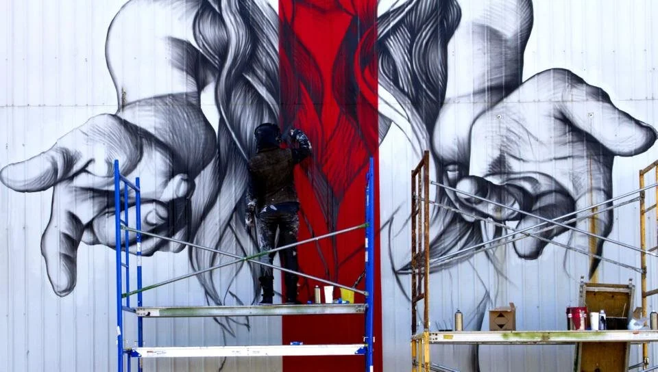 Christina Angelina is an American street artist who is known for her large-scale murals that feature bold and colorful abstract designs. She uses her art to raise awareness about important social and political issues, and she often incorporates images of women and girls who are making a difference in their communities.